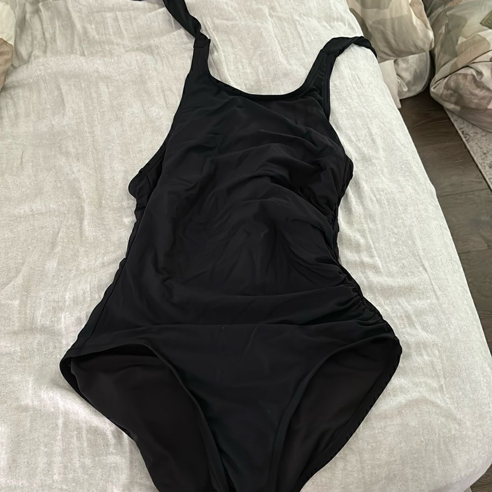 Calvin Klein black one piece swimsuit, size 4, tags removed but it is new